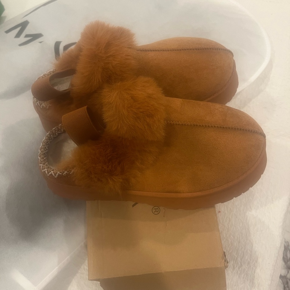 Brand new in box suede slipper. cozy, warm and co